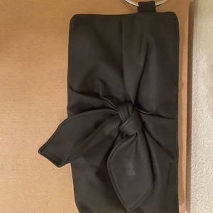 Black classy wristlet with silver ring.